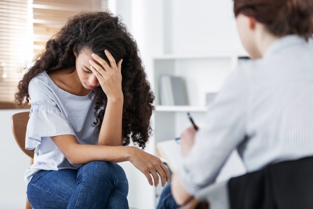 Professional psychotherapies and young woman suffering from mental injury