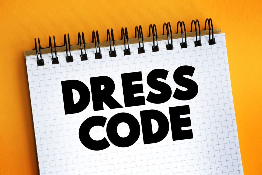 Dress Code text on notepad, concept background